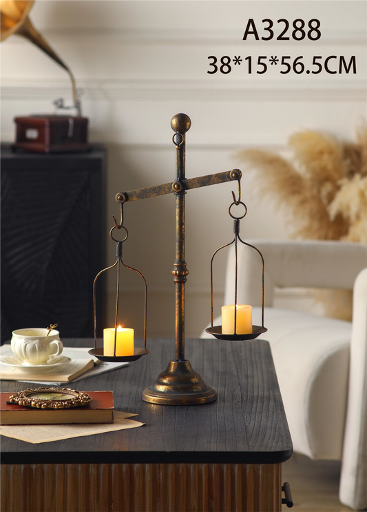 vintage iron candle holder with a balance scale design